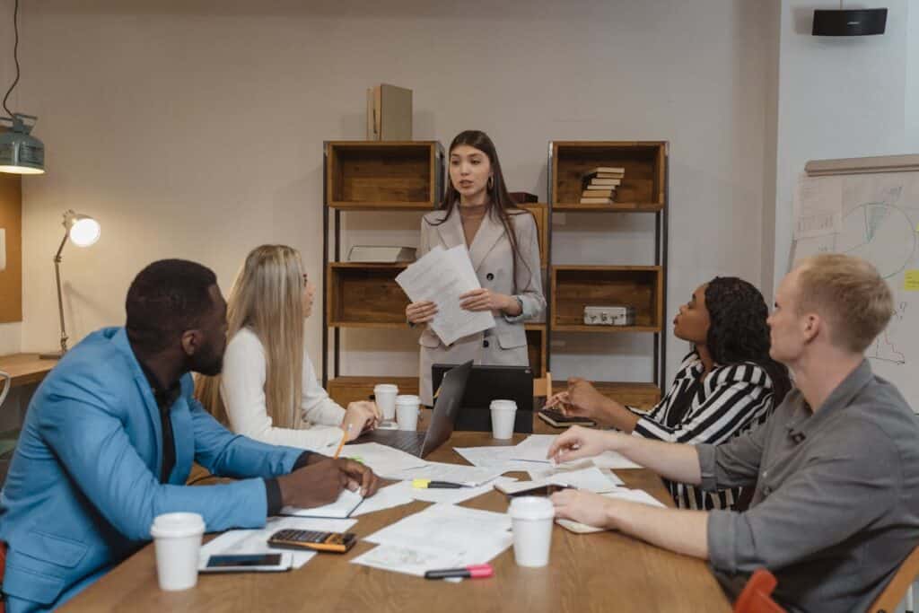 young woman leading her team at work