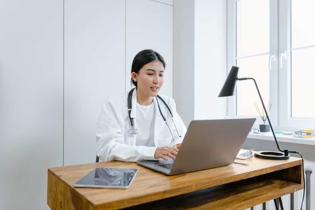 woman working at her desk with laptop