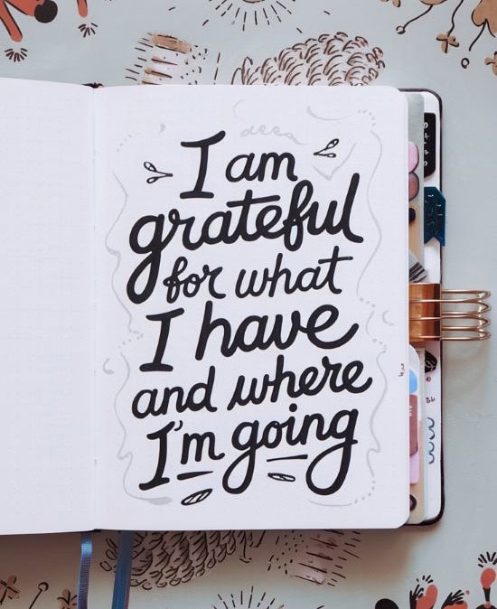 page with positive affirmation written "I am grateful"