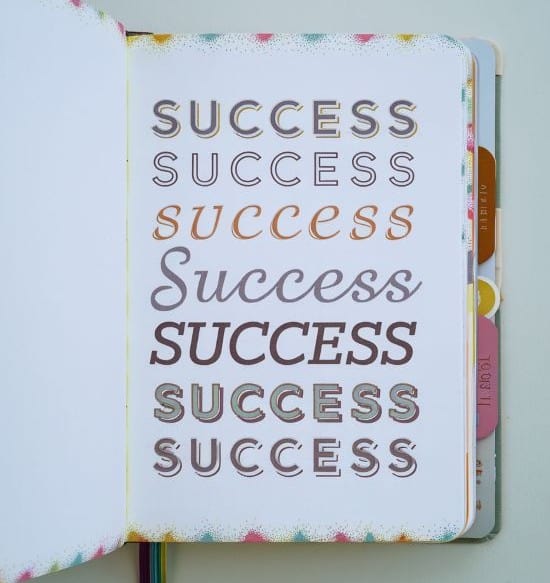 bullet journal cover page with the word success written many times
