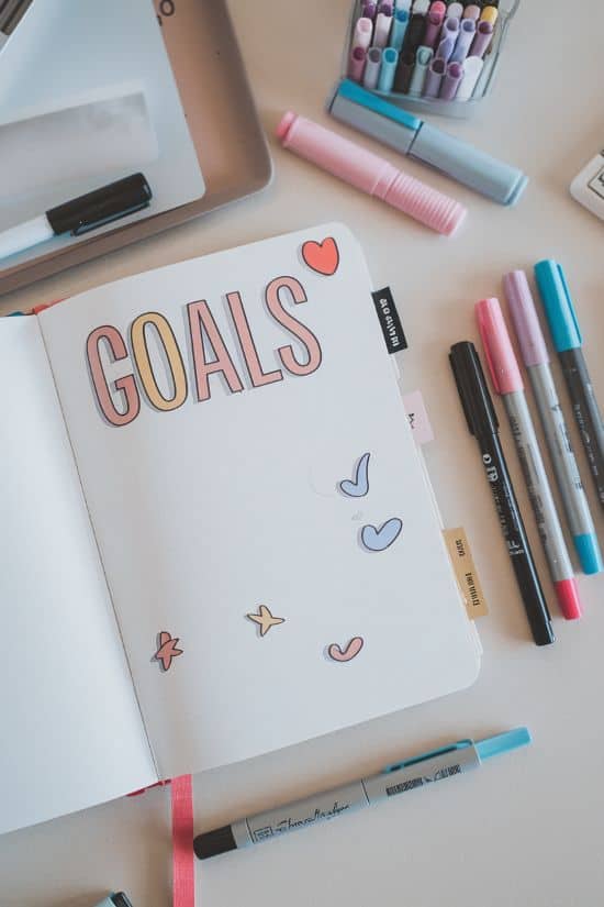 bullet journal open to a page title goals